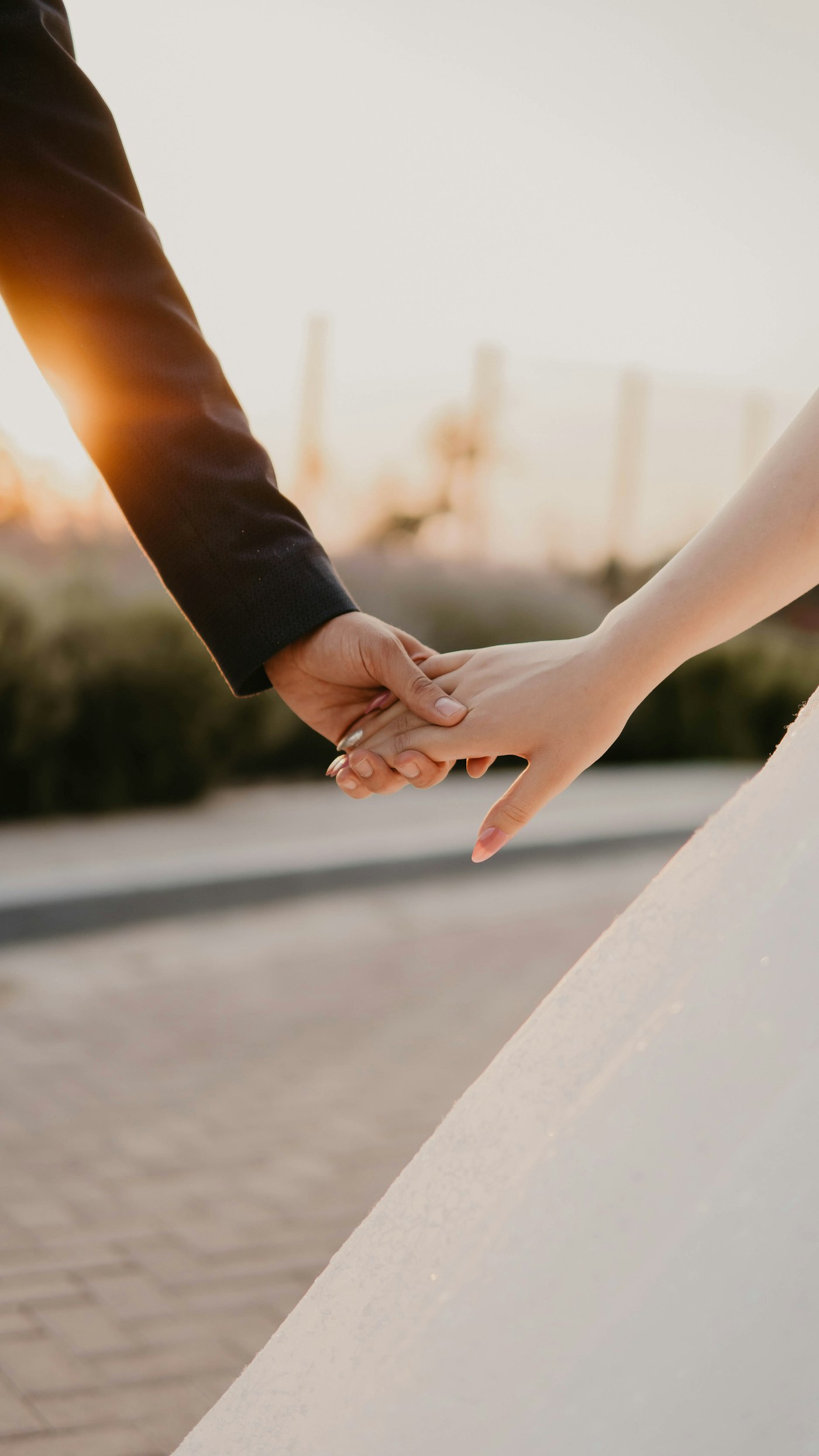 Sample photograph: a close view of a couple holding hands